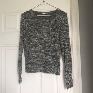 Long sleeve, grey and black shirt.